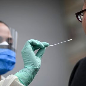 Fridley health workers demonstate COVID-19 drive-up testing