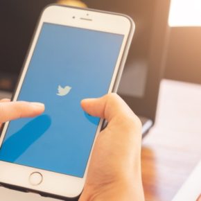 pointing-at-twitter-logo